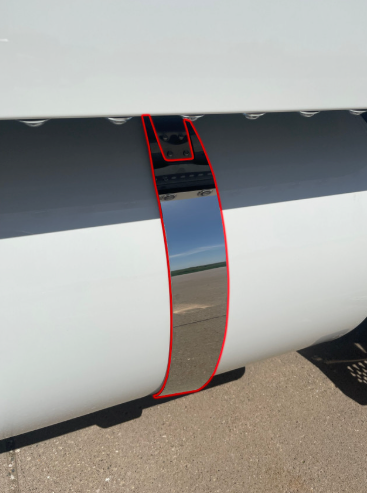 Close-up showing Iowa Customs stainless 4-inch fuel tank strap skin alignment on a Peterbilt — highlighted outline showing precision fit.